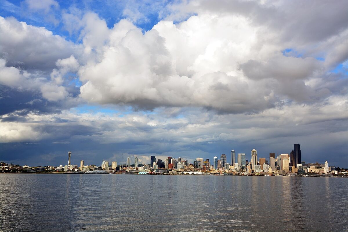 Seattle skyline with Mount Rainier and lush Pacific Northwest nature